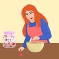 A red-haired young woman cooks and adds the secret ingredient a pinch of love to the dish.